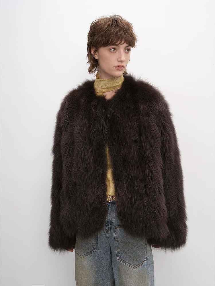 Person wearing a dark brown fur coat on a white background