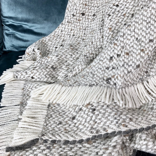 Chunky Gray Weave Alpaca Throw — draped over sofa arm