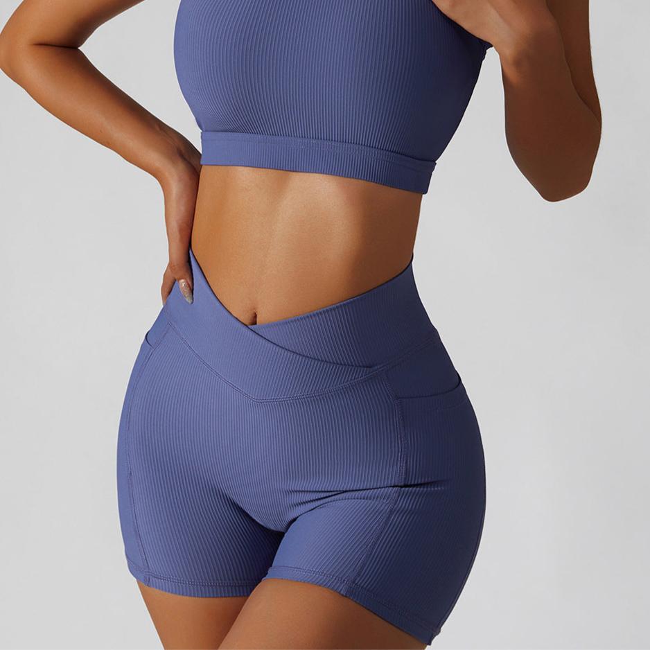 Person wearing a blue athletic outfit on a plain background