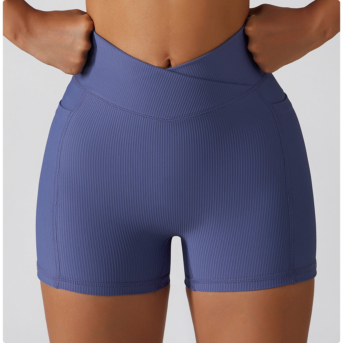Blue athletic shorts worn by a person on a plain background
